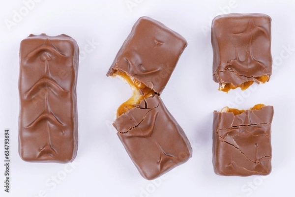 Obraz Whole, fracture and broken into two pieces chocolate bars. Top view.