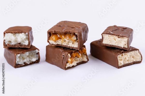 Obraz Set of chocolate bars broken into two pieces. Close-up.