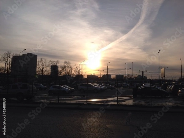 Obraz закат. парковка машин