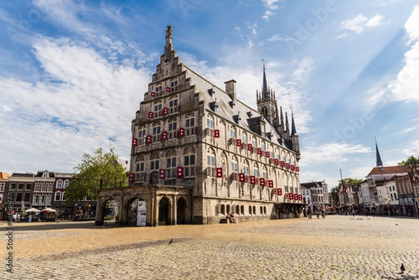 Fototapeta View of the city hall in Gouda, Netherlands. Zuid-Holland. Sightseeing with blue sky