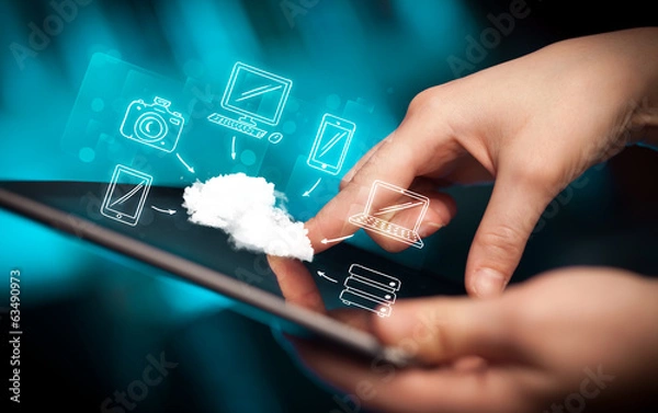 Fototapeta Finger pointing on tablet pc, mobile cloud concept