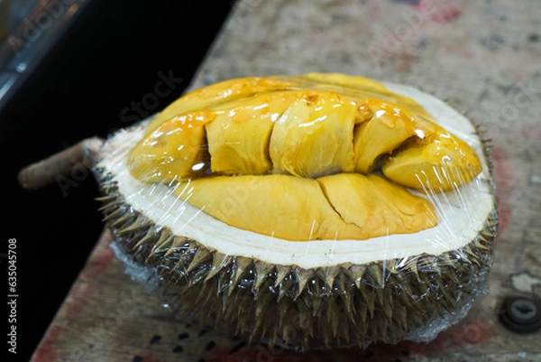 Fototapeta Open durian, wrapped, for display at a durian stall.