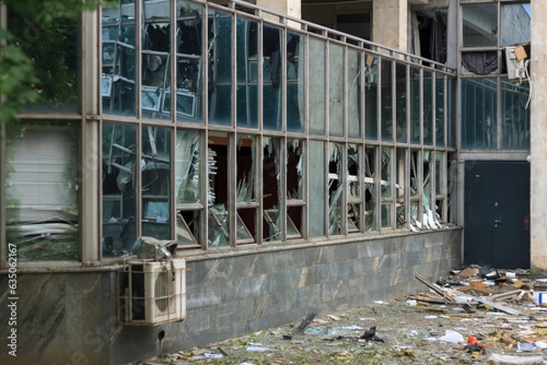 Fototapeta War in Ukraine, Izmail, Odesa region. Building damaged by unmanned aerial vehicle. Civil infrastructure destroyed by russian war drone