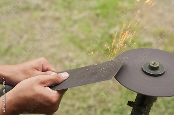 Obraz Lawn mower blade sharpening.