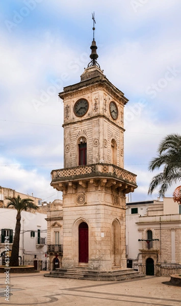 Fototapeta The civic clock tower, commonly known as the Clock Tower, is located in Piazza Plebiscito, Ceglie Messapica, Italy