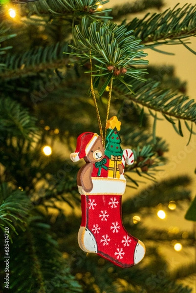 Obraz Small stocking ornament on a christmas tree
