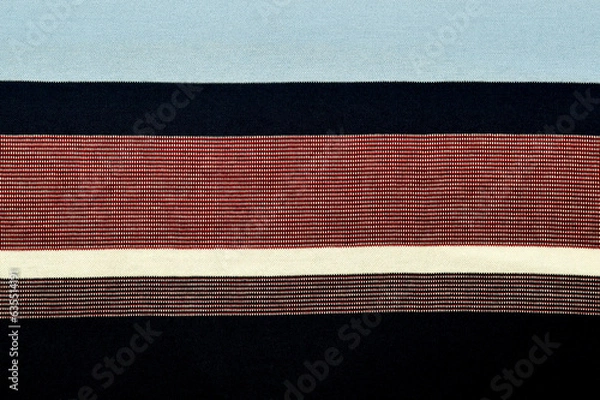 Fototapeta Fabric design background with multicolored horizontal stripes form a pattern, space for text close-up