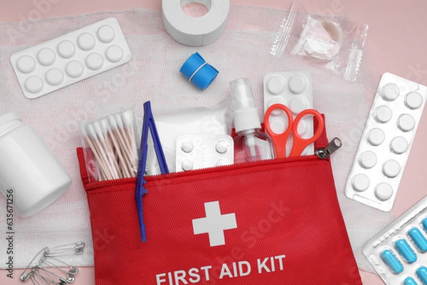 Fototapeta Flat lay composition with first aid kit on pink background