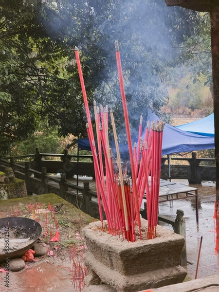 Fototapeta incense sticks in a temple