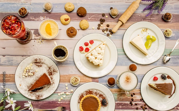 Obraz Dessert table with all kinds sweet snacks on wood background. table. Top view, flat lay