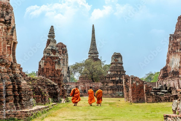 Fototapeta Monks walking beside a temple in Ayuttaya