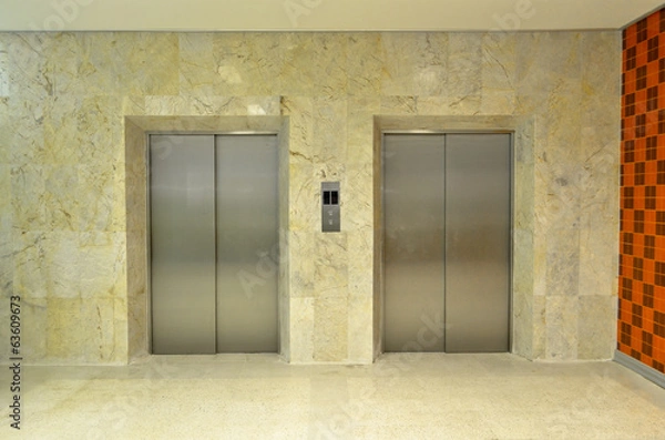 Fototapeta Hallway view of a modern closed elevator..