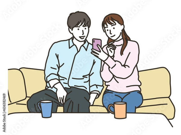 Fototapeta ソファーでスマホを見る笑顔のカップル
