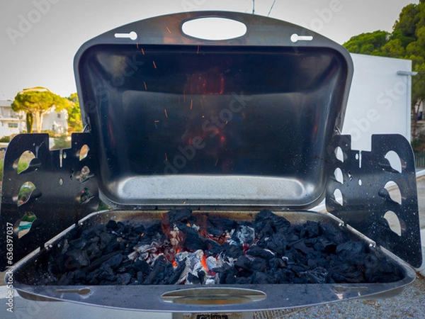 Obraz Opened chrome barbeque with burning coal