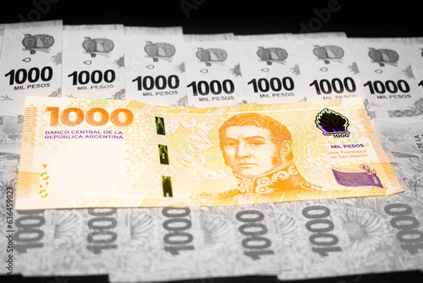 Fototapeta New bill of 1000 Argentine pesos over previous bills of one thousand pesos, San Martin bill, Argentine money, Argentine currency, Argentine pesos. black and white background