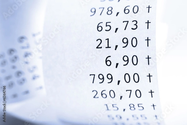 Fototapeta Macro of folded receit paper. Shallow DOF. Blue tone..