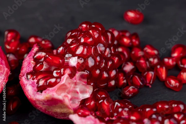Fototapeta Grains of red ripe pomegranate close up