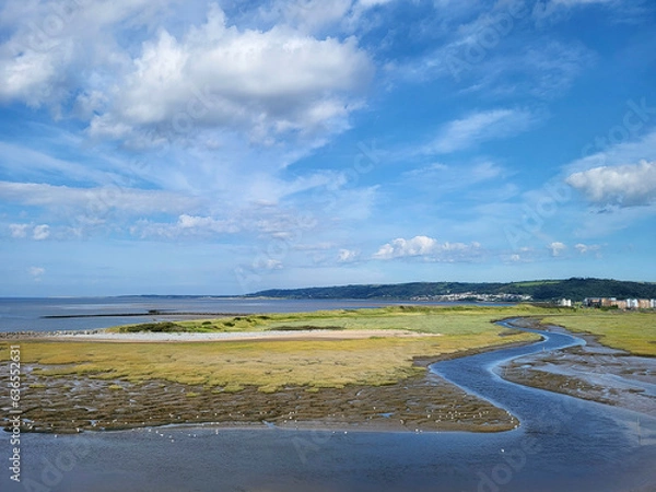 Obraz Incoming tide at North Dock - a former industrial dock exporting coal and tin plate, now reclaimed by nature.