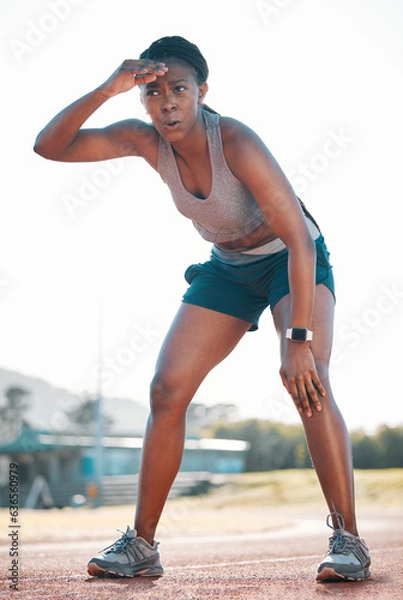 Fototapeta Sweating, tired and black woman at stadium for a race, training or breathing after cardio. Sports, workout and an athlete or African runner with a break after fitness, running or exercise on a track