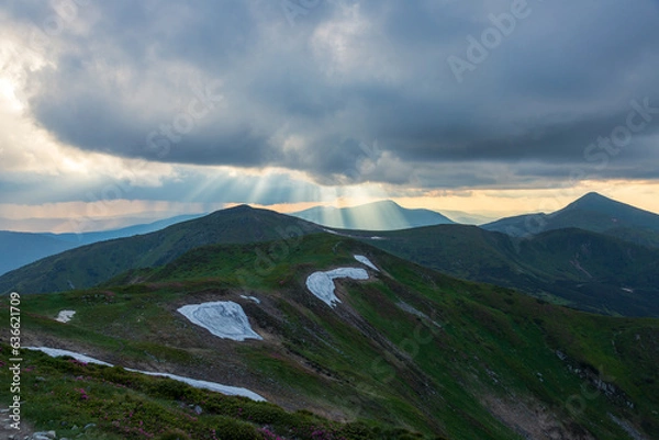 Fototapeta The evening sky over the mountains.