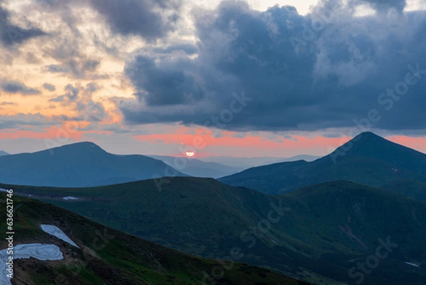Fototapeta The evening sky over the mountains.