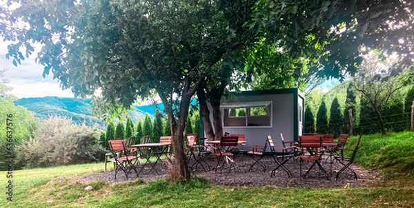 Fototapeta A place for tables and chairs in a campsite