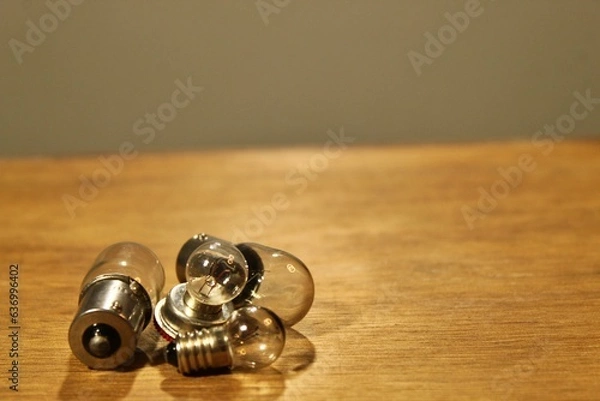 Obraz four lamps piled up on the table