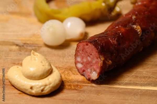 Obraz Grilled Kasekrainer or Cheese Kransky Austrian Sausage with Pickled Onions and Hot Pepper