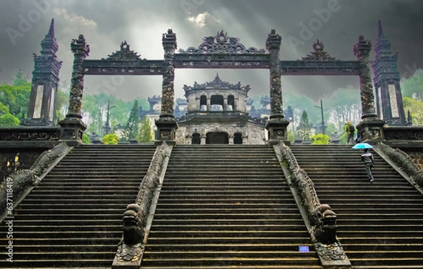 Obraz Mystic atmosphere on rainy day at old vietnamese mausoleum tomb of emperor Khai Dinh, stairway to gates, storm clouds - Hue, Vietnam