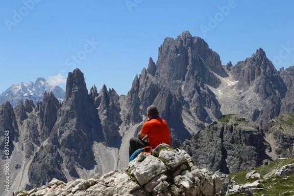 Fototapeta Hiker enjoying the view in Dolomites 