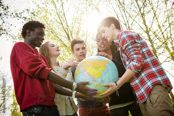 Obraz Multiracial Teen Couple Holding Globe Map