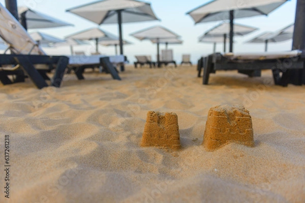 Fototapeta Sunbeds, Beach loungers, Relaxation, Beachside, Umbrellas,