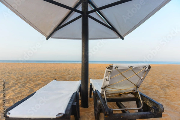 Fototapeta Sunbeds, Beach loungers, Relaxation, Beachside, Umbrellas,