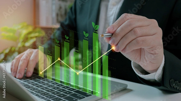 Obraz Businessman use laptop analyzing sustainability company growth with digital virtual graphics, financial data for long term investment.