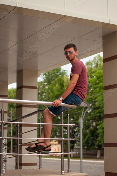 Obraz The young man smiles close up