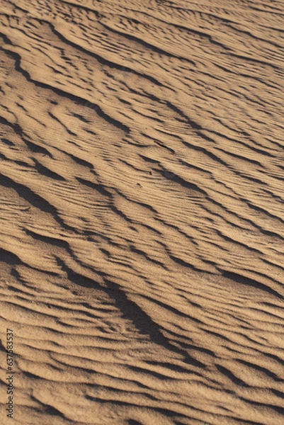 Obraz Intricate and well-defined patterns of light and shadow produced by waves in the sand at the Algodones Sand Dunes in Southern California