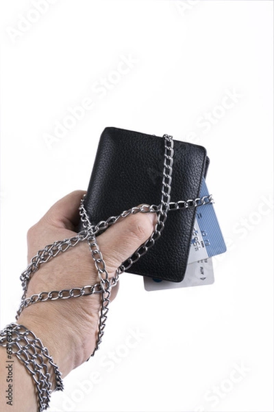 Obraz hand  wallet and credit card tied with chain