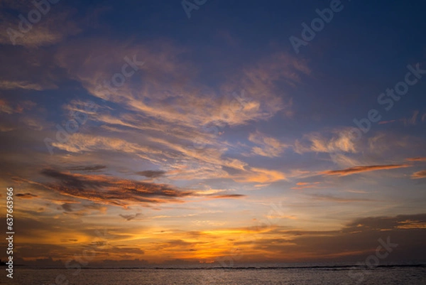 Obraz The colorful sky at sunset and the reflection in the sea look amazing. Nature beautiful Light Sunset or sunrise over sea.Real amazing panoramic sunrise or sunset sky with gentle colorful clouds.