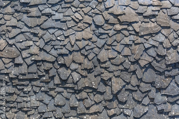 Obraz Detailed view of wall texture randomly lined with slate panels, typical and traditional shale stone material, used as external waterproof cladding in construction