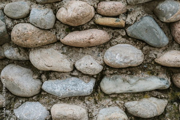 Fototapeta texture of concrete wall with stones and cobblestones