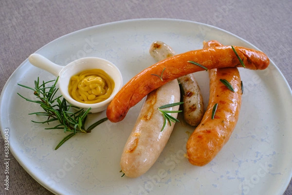 Obraz Homemade German Sausage with sauce in dish