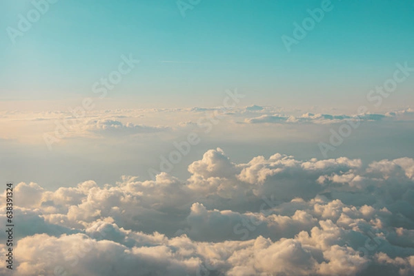 Fototapeta Aerial cloudscaspe view of the picturesque clouds and sky from a height in the morning at dawn over the horizon.