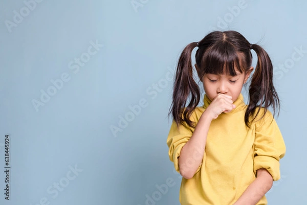 Obraz A little girl is coughing, sick, has a fever.