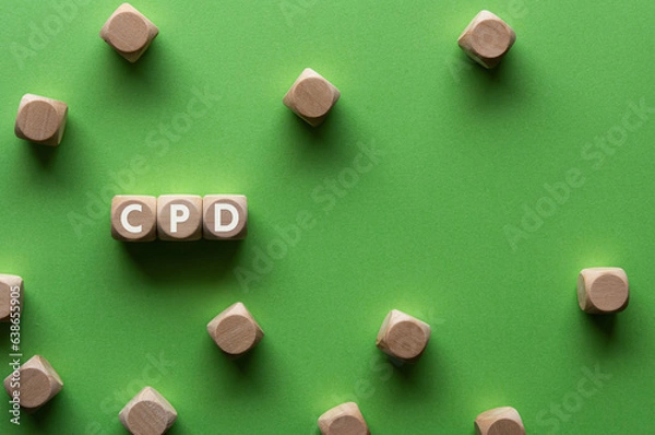 Fototapeta There is wood cube with the word CPD. It is an abbreviation for Continuing Professional Development as eye-catching image.