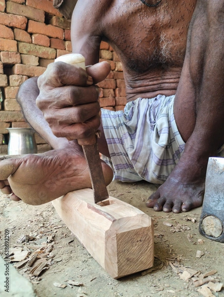 Obraz carpenter working on a wood. A timeless lod man working on wood 
