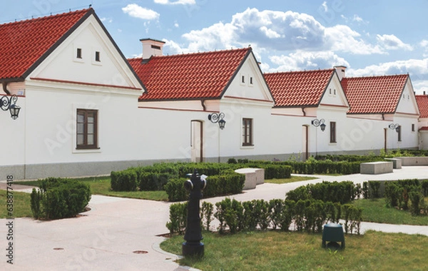 Fototapeta Row of modestly monks' houses in Camaldolese monastery in Wigry village, Poland