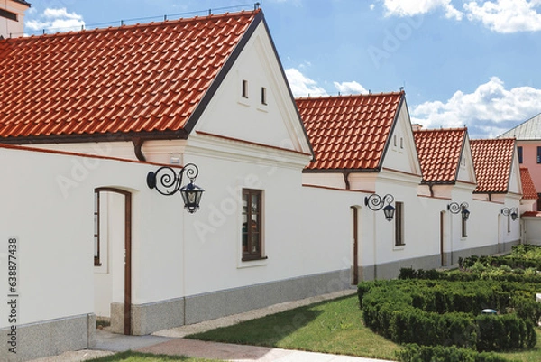 Fototapeta Row of modestly monks' houses in Camaldolese monastery in Wigry village, Poland