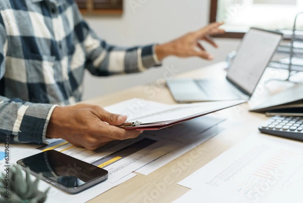 Fototapeta Attractive confident Hispanic Business man using laptop computer and professional working investor start up project business planning in office