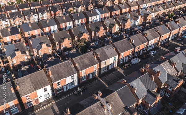 Fototapeta Aerial view above rows of back to back terraced houses on a large council estate