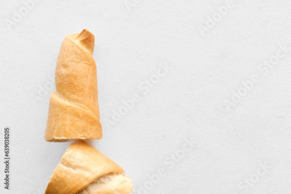 Obraz Delicious Salted Breadstick: Crispy Snack on a Clean White Background